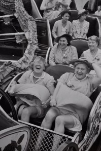 Women on coaster with multiple reactions